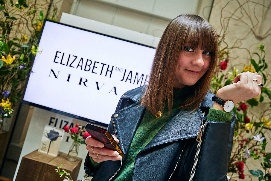 Stylish woman in leather jacket at press launch event photographed by Jon Bradley