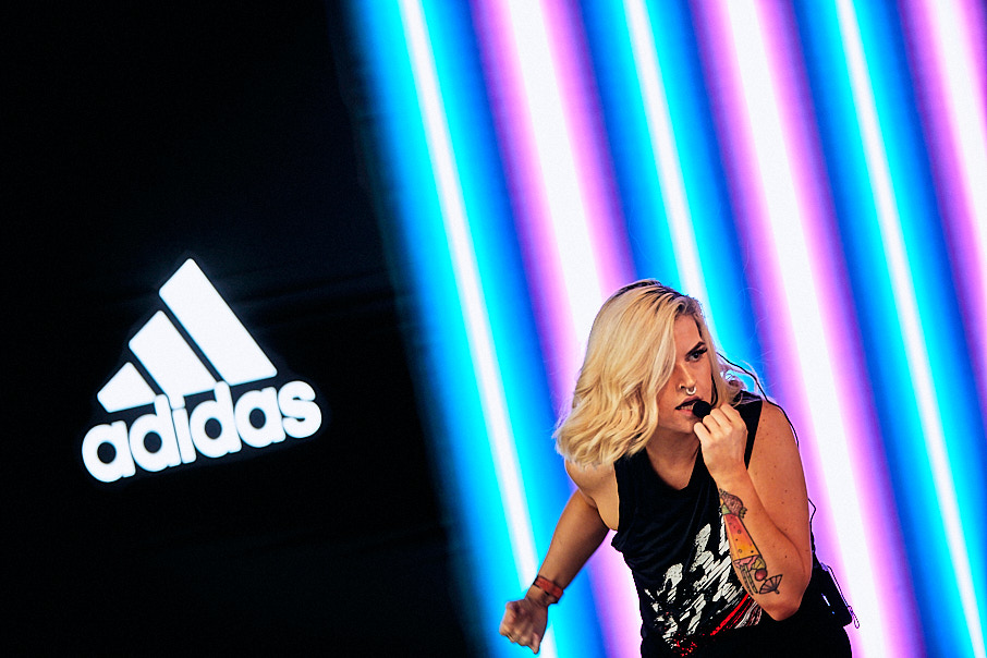 Adidas event with woman presenting on stage